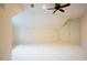 Spacious bonus room with ample natural light from a ceiling fan at 10 Marchmont Ct, Durham, NC 27705