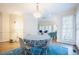Cozy dining area with modern table setting and open view to living room, and a light fan overhead at 10 Marchmont Ct, Durham, NC 27705