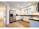 Kitchen featuring stainless steel appliances, granite countertops, and white cabinetry at 10 Marchmont Ct, Durham, NC 27705