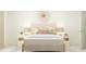 Inviting bedroom with a neutral color palette, stylish headboard, and soft lighting at 109 Queenstown Dr # 9, Kenly, NC 27542