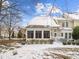 Backyard with a mix of grass and snow, and a screened in porch at 112 White Lake Ct, Cary, NC 27519