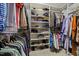 Walk-in closet with shelves and hanging racks for organization at 112 White Lake Ct, Cary, NC 27519