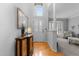 Bright entryway with hardwood floors and an elegant console table at 112 White Lake Ct, Cary, NC 27519