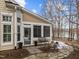 Cozy sunroom with access to a stone patio and view of the yard at 112 White Lake Ct, Cary, NC 27519