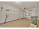 Spacious garage with epoxy floor, shelving, and ample room for storage at 1153 Kingston Grove Dr, Cary, NC 27519