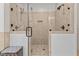 Walk in glass enclosed shower featuring multi-head fixtures and tiled walls at 1328 Wakefield Farm Rd, Zebulon, NC 27597