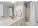 Bright bathroom featuring a white vanity, granite countertop, and a shower with dark bronze fixtures at 1328 Wakefield Farm Rd, Zebulon, NC 27597