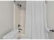 Bathroom featuring a shower-tub combo with white shower curtain at 1328 Wakefield Farm Rd, Zebulon, NC 27597