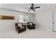 Comfortable bedroom with two brown leather chairs and plenty of natural light at 1328 Wakefield Farm Rd, Zebulon, NC 27597