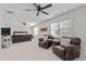 Spacious bedroom with a dark wood sleigh bed and comfortable seating at 1328 Wakefield Farm Rd, Zebulon, NC 27597