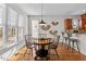 Cozy breakfast nook with round table, four chairs, and natural light from nearby windows at 1328 Wakefield Farm Rd, Zebulon, NC 27597