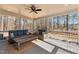 Inviting outdoor porch featuring comfortable seating and a view of the wooded backyard at 1328 Wakefield Farm Rd, Zebulon, NC 27597