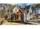 This home offers a charming facade, attached garage, and well-maintained landscaping at 1328 Wakefield Farm Rd, Zebulon, NC 27597