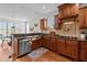 Well-appointed kitchen with stainless steel appliances and dark wood cabinetry at 1328 Wakefield Farm Rd, Zebulon, NC 27597