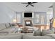 Inviting living room with fireplace, mounted TV, and comfortable, neutral-toned seating at 1328 Wakefield Farm Rd, Zebulon, NC 27597