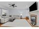 Spacious living room offers a fireplace, mounted TV, and comfortable seating area at 1328 Wakefield Farm Rd, Zebulon, NC 27597