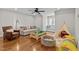 Bright playroom featuring hardwood floors, cozy seating, and fun play areas at 1328 Wakefield Farm Rd, Zebulon, NC 27597
