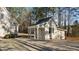 Detached shed with a covered area, providing extra storage and functionality to the property at 1328 Wakefield Farm Rd, Zebulon, NC 27597