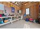 Unfinished shed interior featuring a workbench and pegboard, ready for customization and organization at 1328 Wakefield Farm Rd, Zebulon, NC 27597