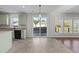 Eat-in kitchen featuring shaker cabinets, neutral paint, and stainless steel dishwasher at 1510 Roaring Rapids Rd, Raleigh, NC 27610