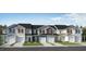 Charming new construction townhomes featuring diverse colors, private garages and inviting curb appeal at 154 Parker Ln, Mebane, NC 27302