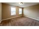 Cozy bedroom with neutral walls and carpet, featuring two windows for natural light and a welcoming feel at 1546 Tinos Overlook Way, Apex, NC 27502
