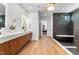 The luxury main bathroom features a modern vanity, large soaking tub, and private toilet at 1616 Hunting Ridge Rd, Raleigh, NC 27615