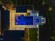 Overhead view of a modern home with a pool, spa, and well-maintained landscaping at 1616 Hunting Ridge Rd, Raleigh, NC 27615