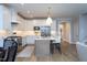 Bright kitchen with white cabinetry, stainless steel appliances, and a center island at 1733 Deacon Falls Way, Wendell, NC 27591