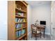 Well-lit home office with a bookcase and a desk at 1733 Deacon Falls Way, Wendell, NC 27591