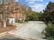 Spacious driveway that leads to a brick home with an attached two-car garage and fenced backyard at 200 Valleyshire Rd, Durham, NC 27707