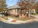 Brick home on a corner lot showcasing well-maintained landscaping, sidewalks, and a manicured lawn at 200 Valleyshire Rd, Durham, NC 27707