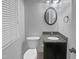Small bathroom featuring modern fixtures, granite countertop, and ample lighting for everyday use at 206 Collegiate Cir, Durham, NC 27713