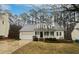 Charming one-story home featuring a welcoming front porch, dormer windows and attached garage at 206 Collegiate Cir, Durham, NC 27713