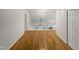 A hallway on the second floor with hardwood floors and white railings and trim at 206 Collegiate Cir, Durham, NC 27713