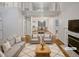 Bright living room boasting hardwood floors, a fireplace, and a soaring open staircase at 206 Collegiate Cir, Durham, NC 27713