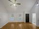 Open-concept living room with hardwood floors, bright windows, and a welcoming atmosphere at 206 Collegiate Cir, Durham, NC 27713