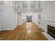 Spacious living room features an open staircase, hardwood floors, and a fireplace at 206 Collegiate Cir, Durham, NC 27713