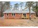 Exterior shot of the back of a brick home showing new back porches and new storm windows at 2116 Nc Highway 751, Apex, NC 27523