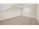 Spacious bedroom with neutral walls and ceiling fan for comfort at 2410 Carpenter Pond Rd, Raleigh, NC 27613