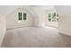 Bright bedroom with large windows offering scenic views and natural light at 2410 Carpenter Pond Rd, Raleigh, NC 27613