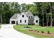 Two-story home with a two-car garage and well-manicured lawn at 2410 Carpenter Pond Rd, Raleigh, NC 27613