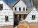 Close up of the house's front entrance with brick steps under construction at 2410 Carpenter Pond Rd, Raleigh, NC 27613