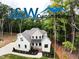 Stunning two-story home featuring a modern design, neutral color palette, and beautifully landscaped front yard at 2410 Carpenter Pond Rd, Raleigh, NC 27613