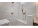Close-up of a tiled shower with a shower bench, shower head, and fixtures at 2410 Carpenter Pond Rd, Raleigh, NC 27613