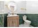 Stylish powder room with modern fixtures, herringbone accent wall and round mirror at 2515 W Club Blvd, Durham, NC 27705