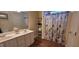 Bathroom with double sink vanity and nautical themed shower curtain at 266 Sagamore Dr, Louisburg, NC 27549