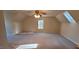 Bright bedroom with neutral carpet, ceiling fan, attic window, and white trim at 266 Sagamore Dr, Louisburg, NC 27549