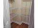 Walk-in closet featuring wood floors and wire shelving for optimal storage and organization at 266 Sagamore Dr, Louisburg, NC 27549