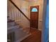 Welcoming entryway with wood-look floors, stairs, and a charming front door with stained glass at 266 Sagamore Dr, Louisburg, NC 27549